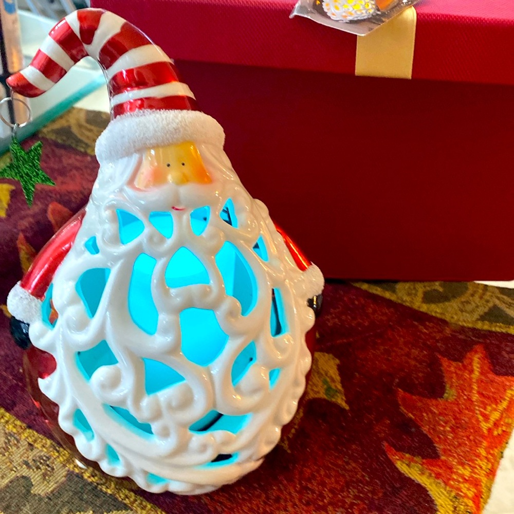 Santa Claus with candle inside